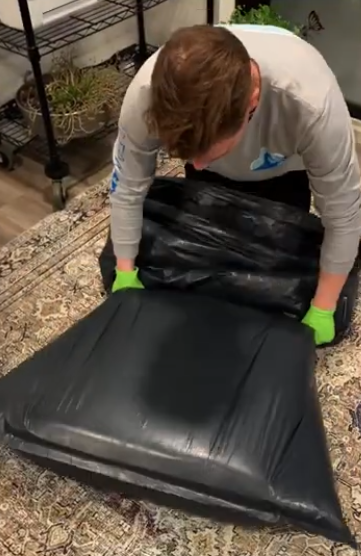 brandon sealing a  couch cushion to eliminate odors